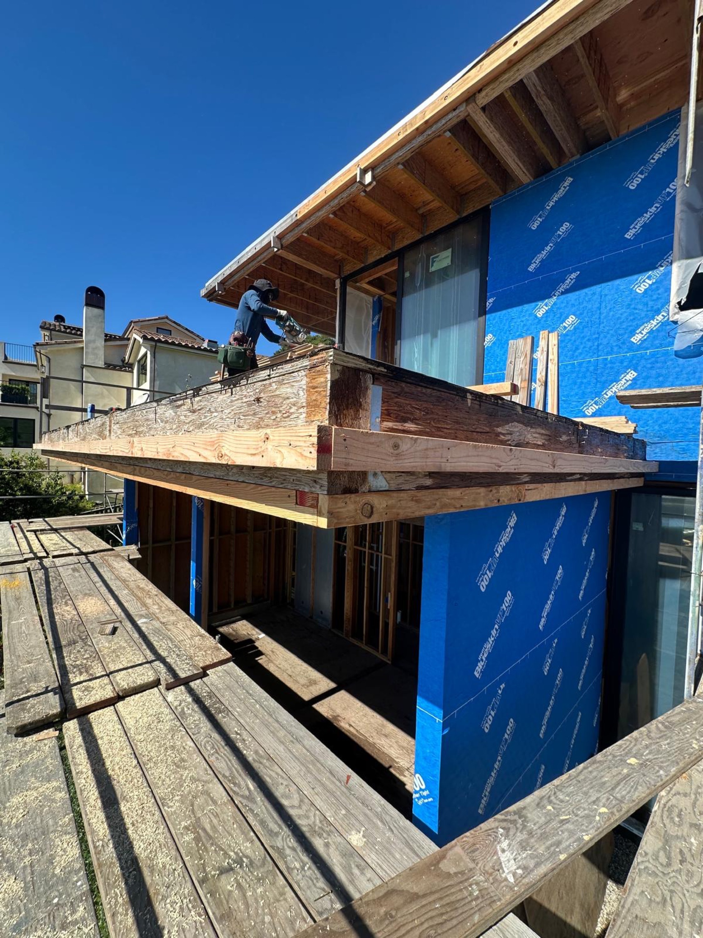 Exterior walls wrapped in waterproofing membrane ahead of new siding